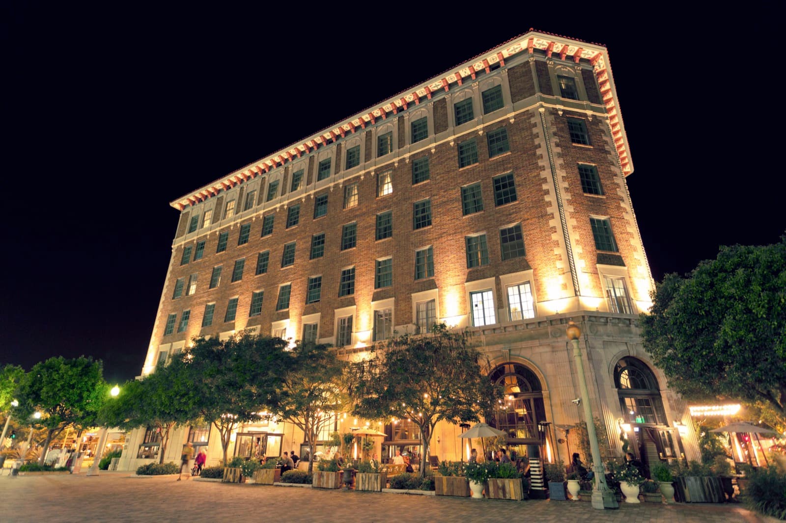 The historic 1924 Culver Hotel glowing at dusk in downtown Culver City