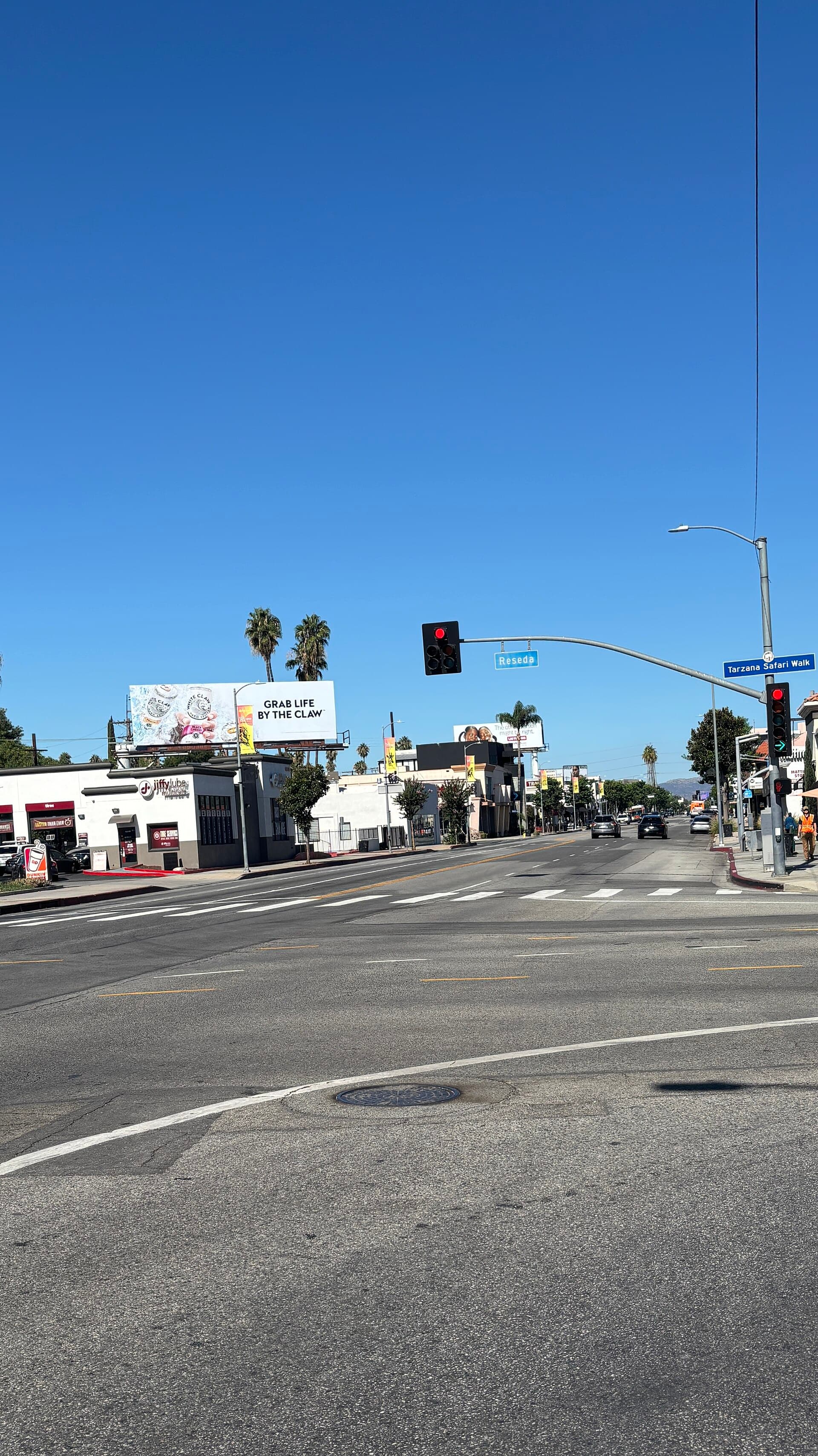 Ventura Boulevard at Reseda Boulevard in Tarzana, marked by a Tarzana Safari Walk street sign